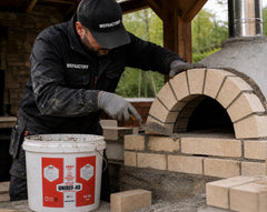 UNIREF-40 44 lb refractory mortar bucket being used on a brick oven